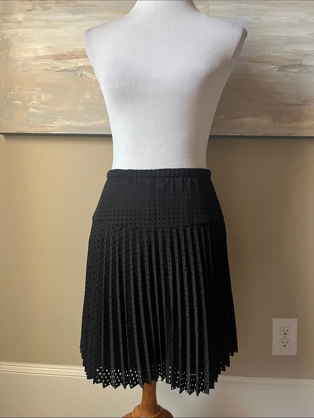 J. Crew black laser cut pleated A-line skirt.